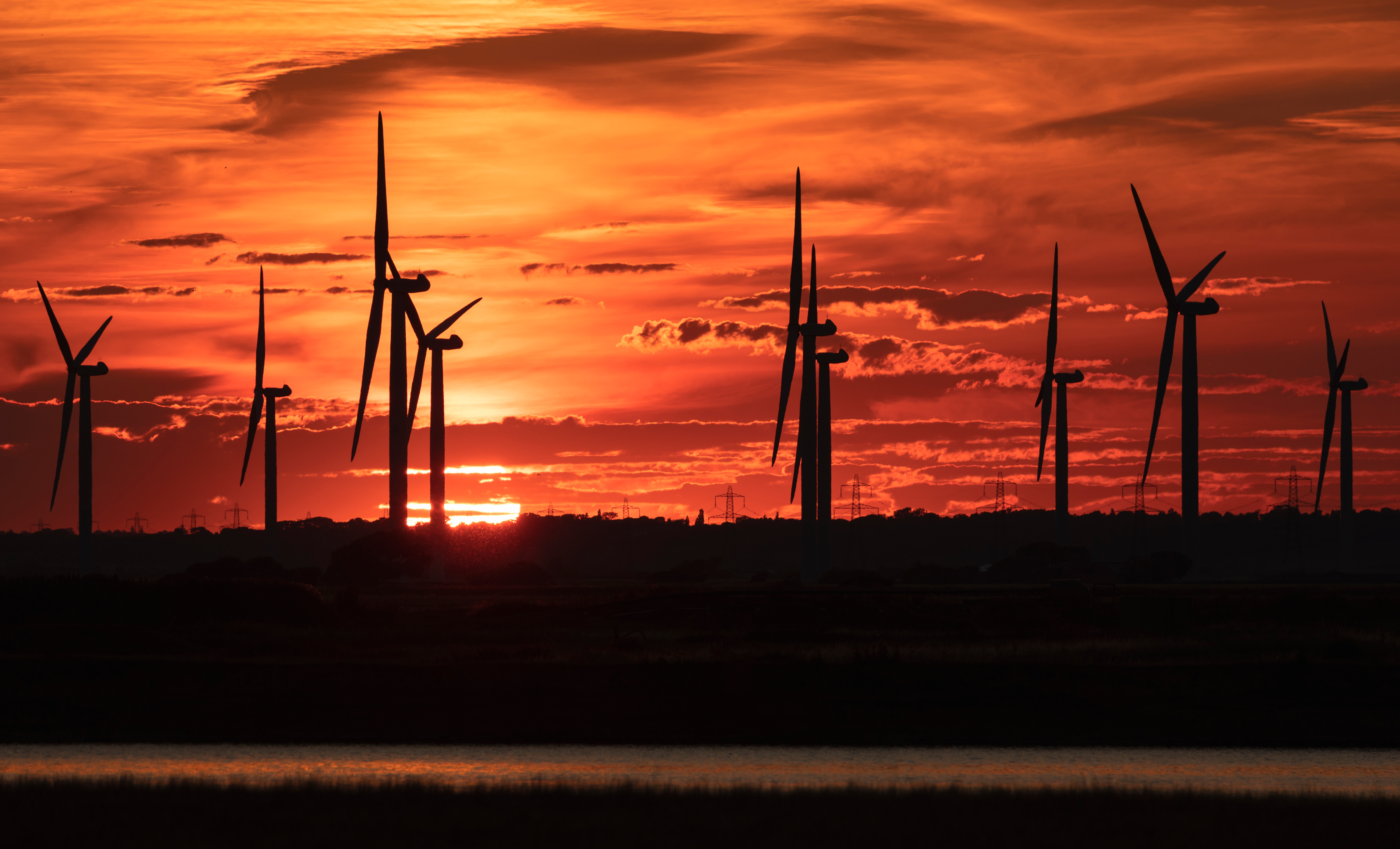 July sunset sky behind Little Cheyne Court wind farm on Romney Marsh on the East Sussex Kent border south east England