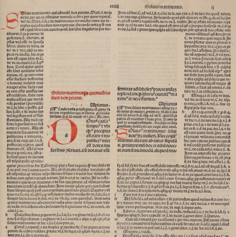 Part of a printed page of Latin text, laid out in two columns around an inset square central section, with red rubric and initials.