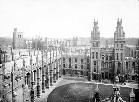 A black and white photograph of the Great Quad at All Souls College with tennis courts marked on the grass