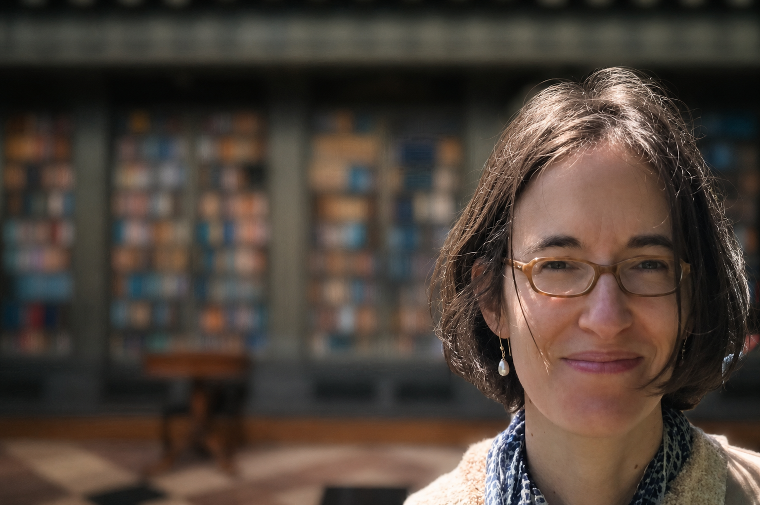 Professor Lucia Prauscello with library background