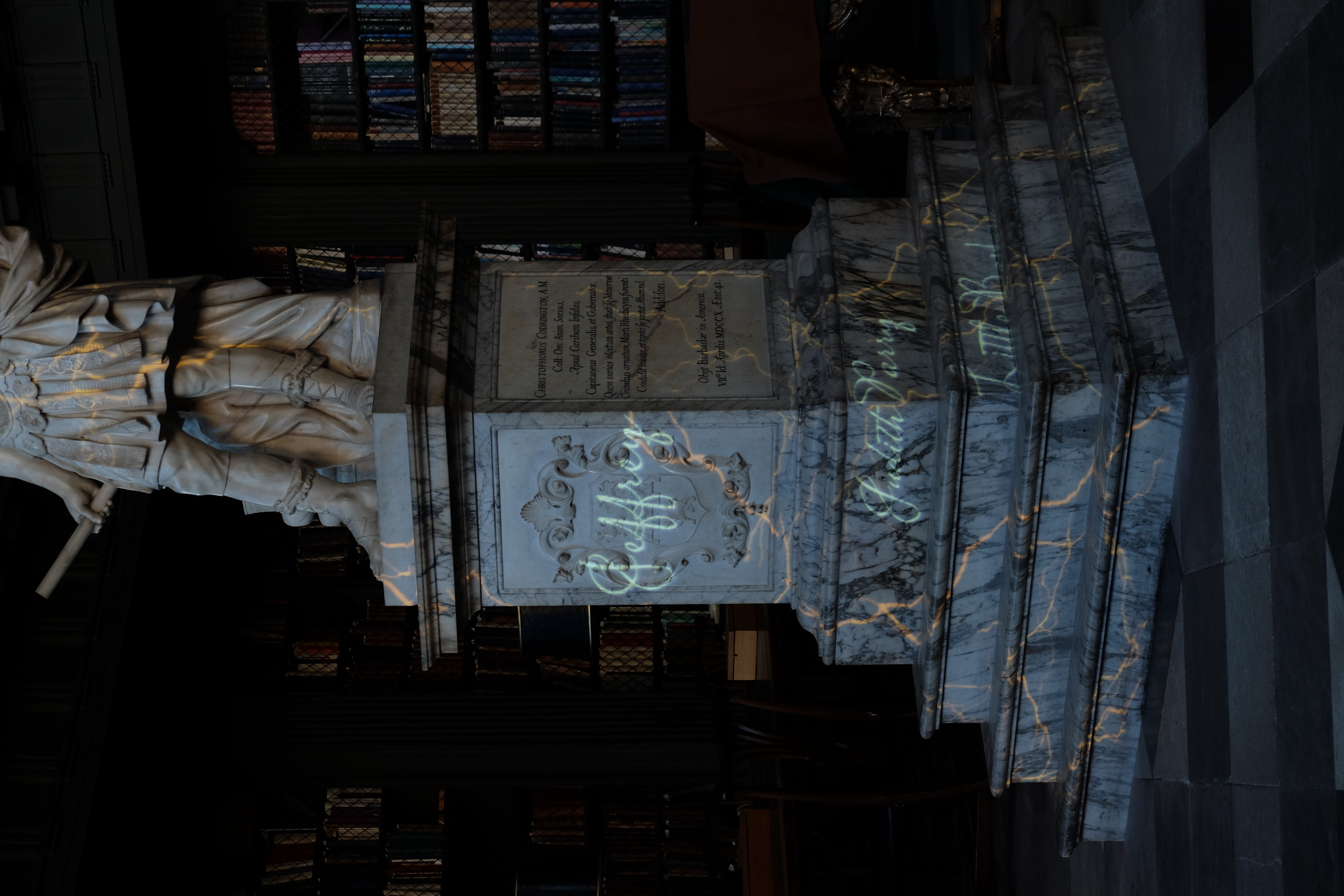 Plinth of the Codrington statue, with names (Jeffrey, Judith Parry, Little Barbara) projected on it. 