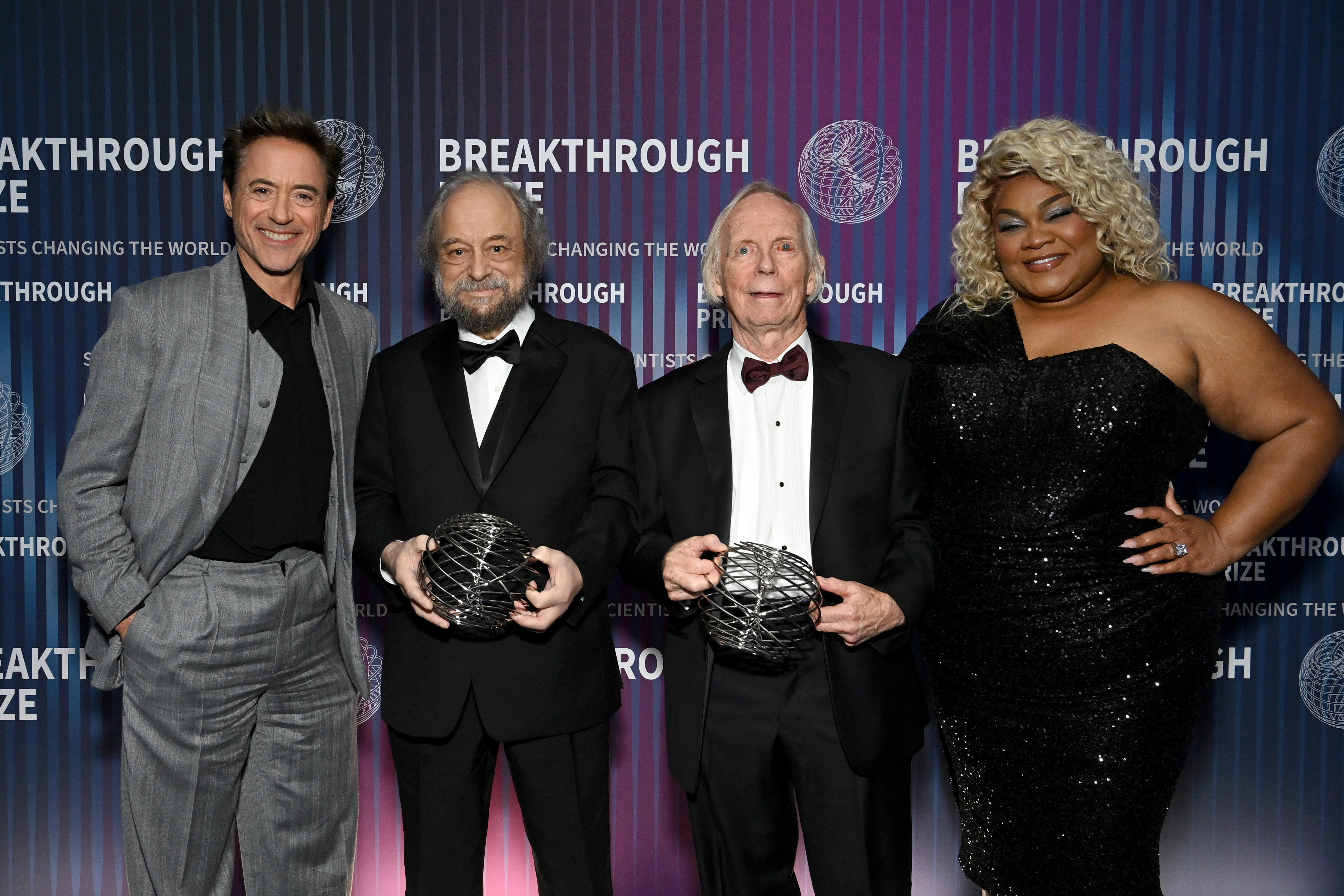	LOS ANGELES, CALIFORNIA - APRIL 13: (L-R) Robert Downey Jr., honoree Dr. Alexander Zamolodchikov, honoree Dr. John Cardy, and Da'Vine Joy Randolph pose with awards during the 10th Breakthrough Prize Ceremony at the Academy of Motion Picture Arts and Sciences on April 13, 2024 in Los Angeles, California. (Photo by Jon Kopaloff/Getty Images for Breakthrough Prize)