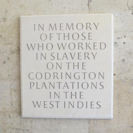Stone plaque engraved "In memory of those who worked in slavery on the Codrington plantations in the West Indies"