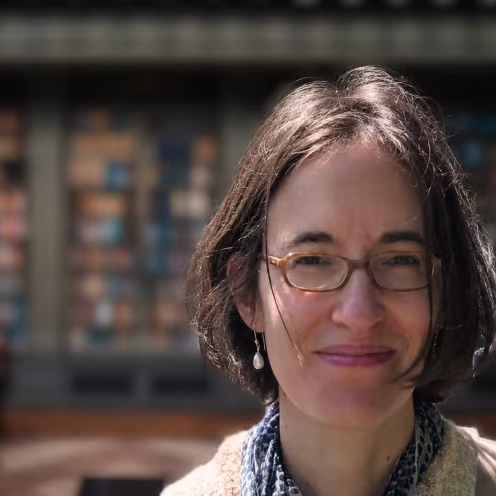 Professor Lucia Prauscello with library background