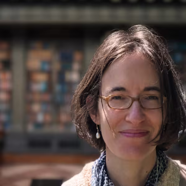 Professor Lucia Prauscello with library background