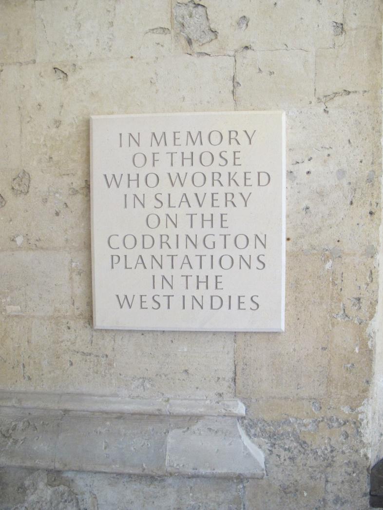 plaque bearing the text 'In memory of those who worked in slavery on the Codrington plantations in the West Indies'